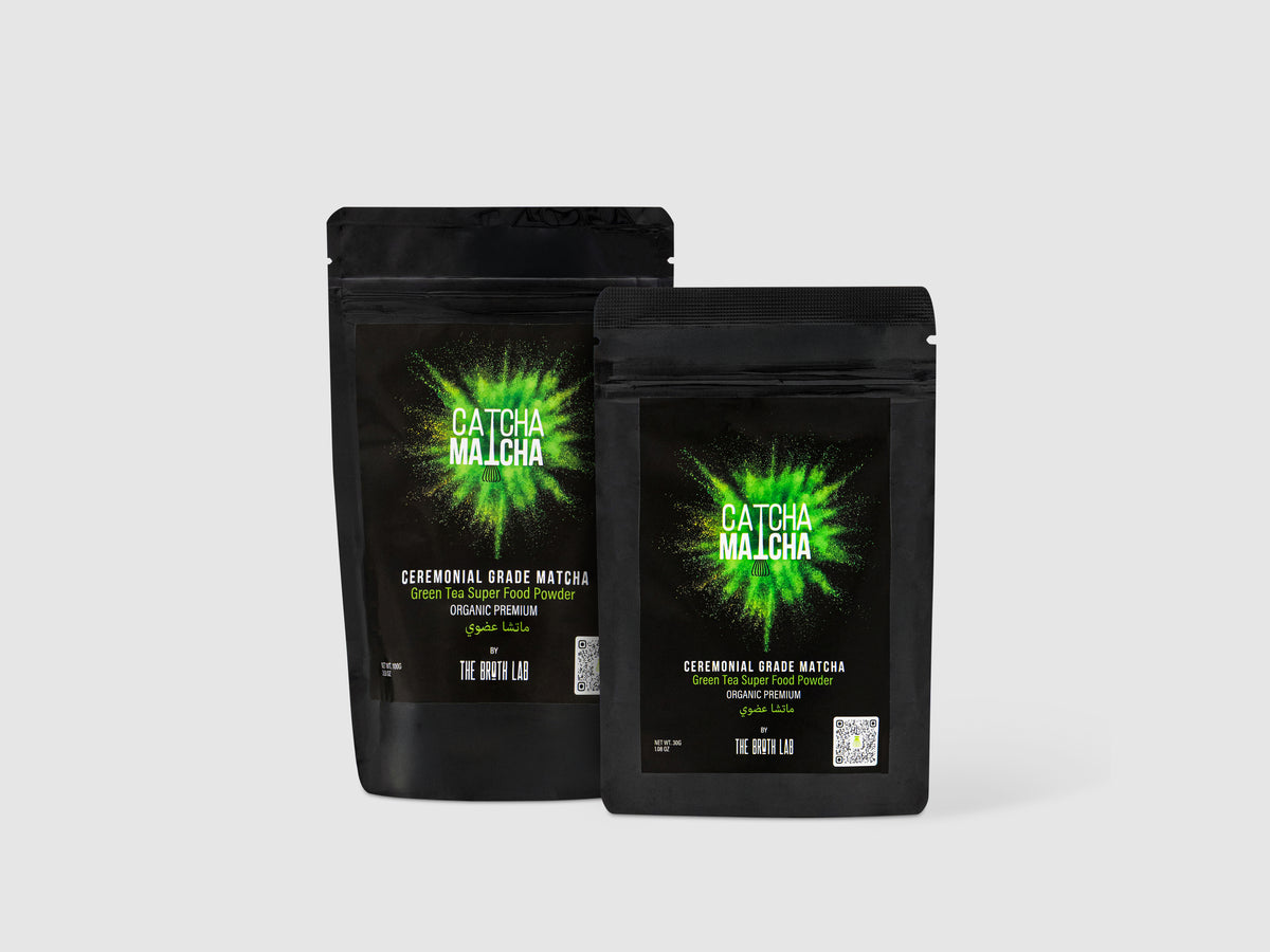 Two black matcha powder pouches with green Catcha Matcha logo and ceremonial label