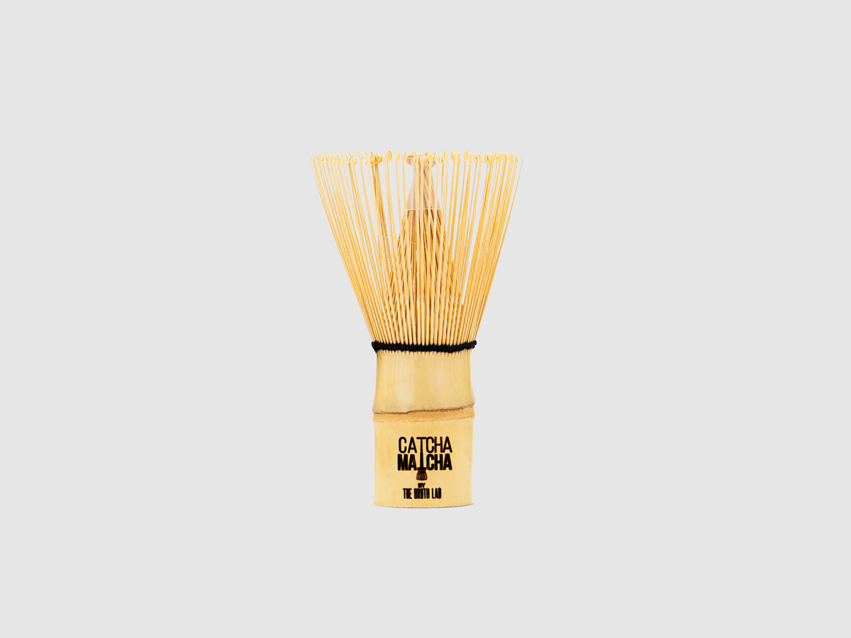 Bamboo matcha whisk with wooden handle and Catcha Matcha label