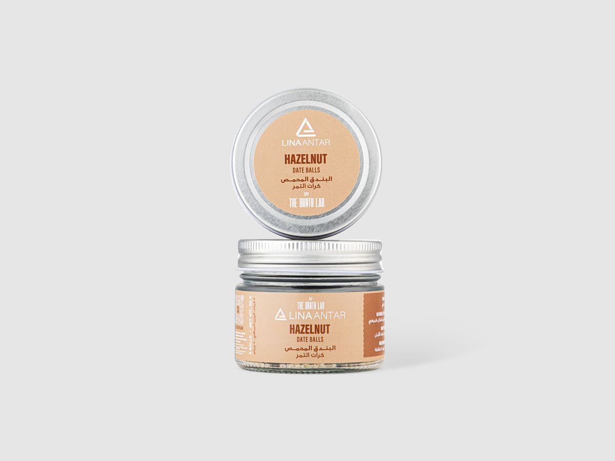 Organic MCT hazelnut energy balls in glass jar with metal lid