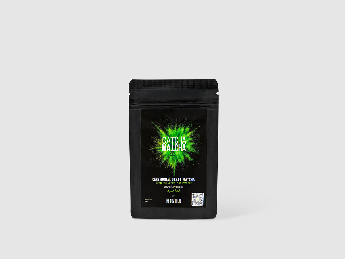 Ceremonial grade matcha powder bag, black pouch with green Catcha Matcha logo