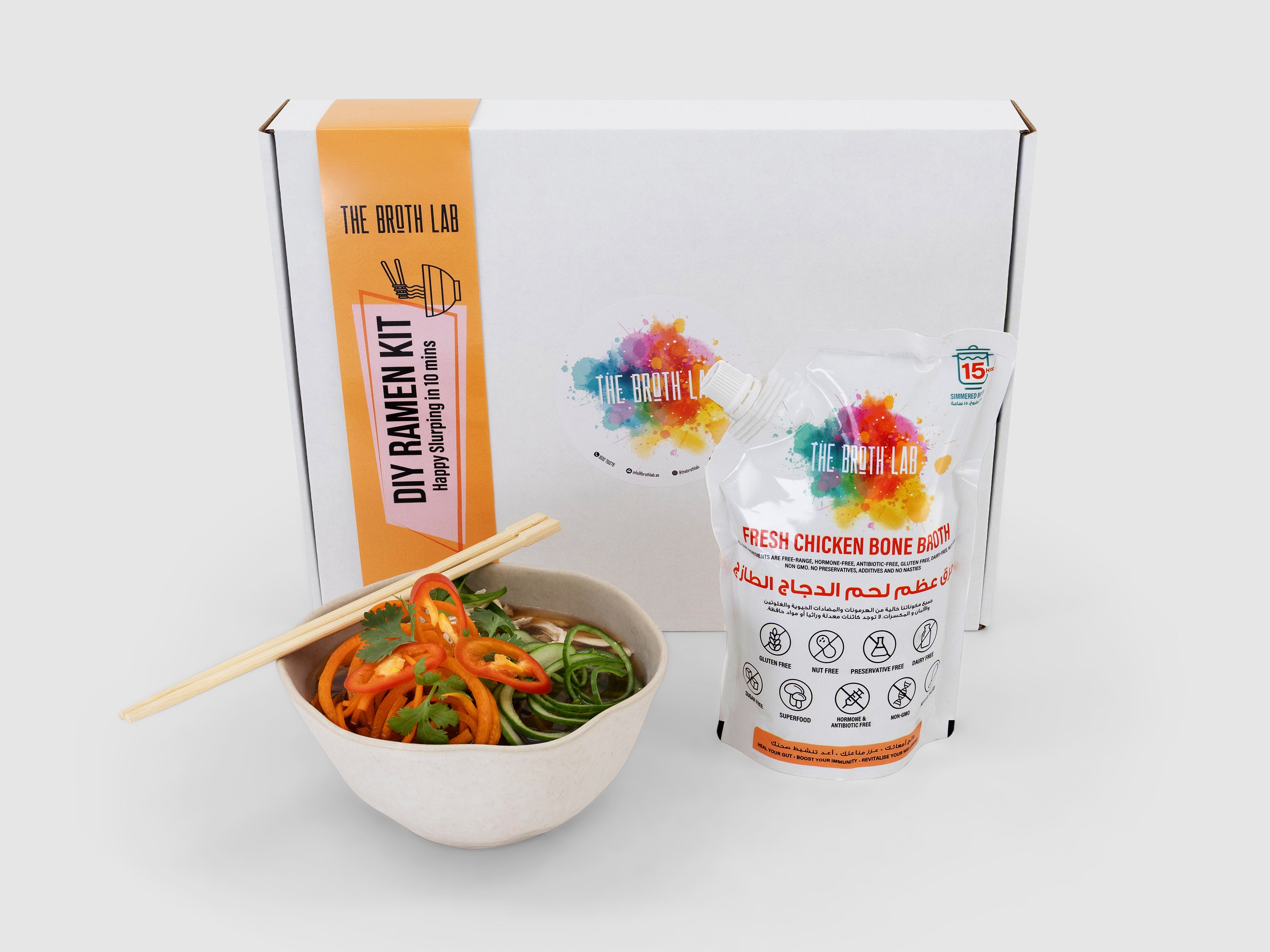 Broth lab ramen kit with a bowl of noodles and ingredients on a white background