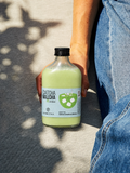 Cymbiotika Catcha Malcha green colostrum bottle with black cap